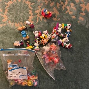 Dozens of Charlie Brown, Winnie Pooh and Cabbage Patch Figures